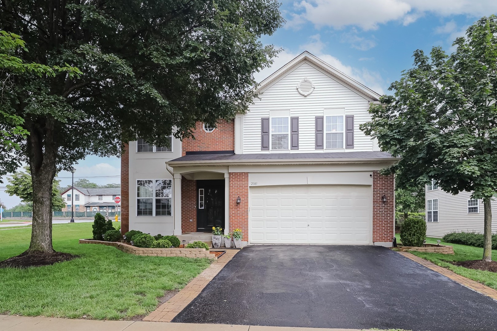 2101 Silverleaf Court Addison, IL 60101 - Photo 1 of 41 a front view of a house with garden