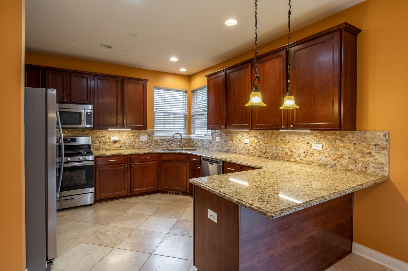 2101 Silverleaf Court Addison, IL 60101 - Photo 11 of 41 a kitchen with a stove a sink and a microwave