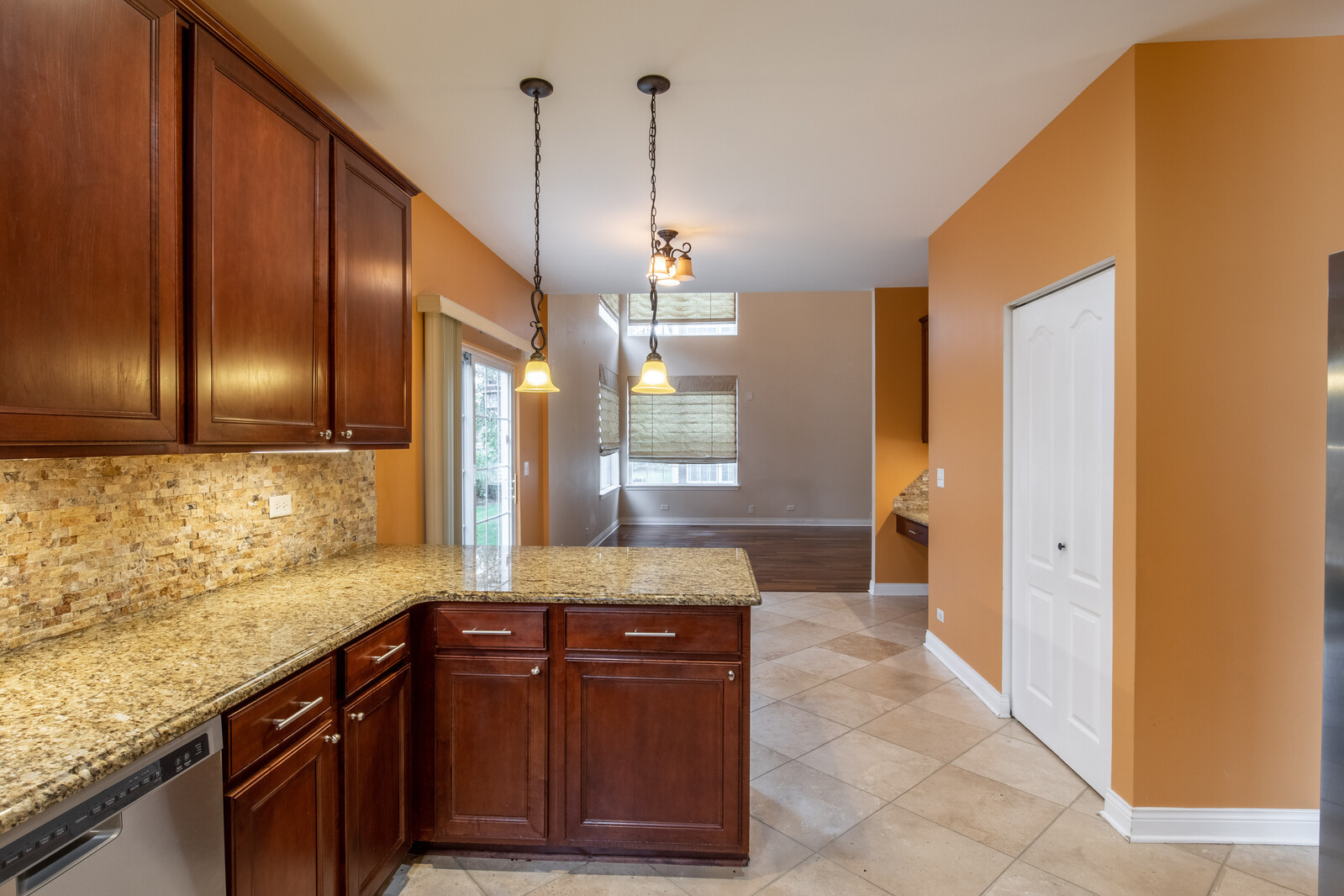 2101 Silverleaf Court Addison, IL 60101 - Photo 14 of 41 a kitchen with granite countertop cabinets and wooden floor