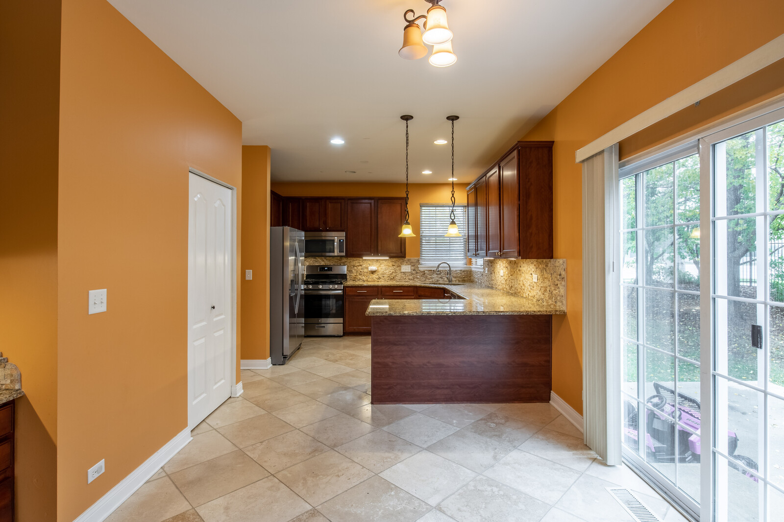 2101 Silverleaf Court Addison, IL 60101 - Photo 17 of 41 a kitchen with stainless steel appliances granite countertop a refrigerator and a sink