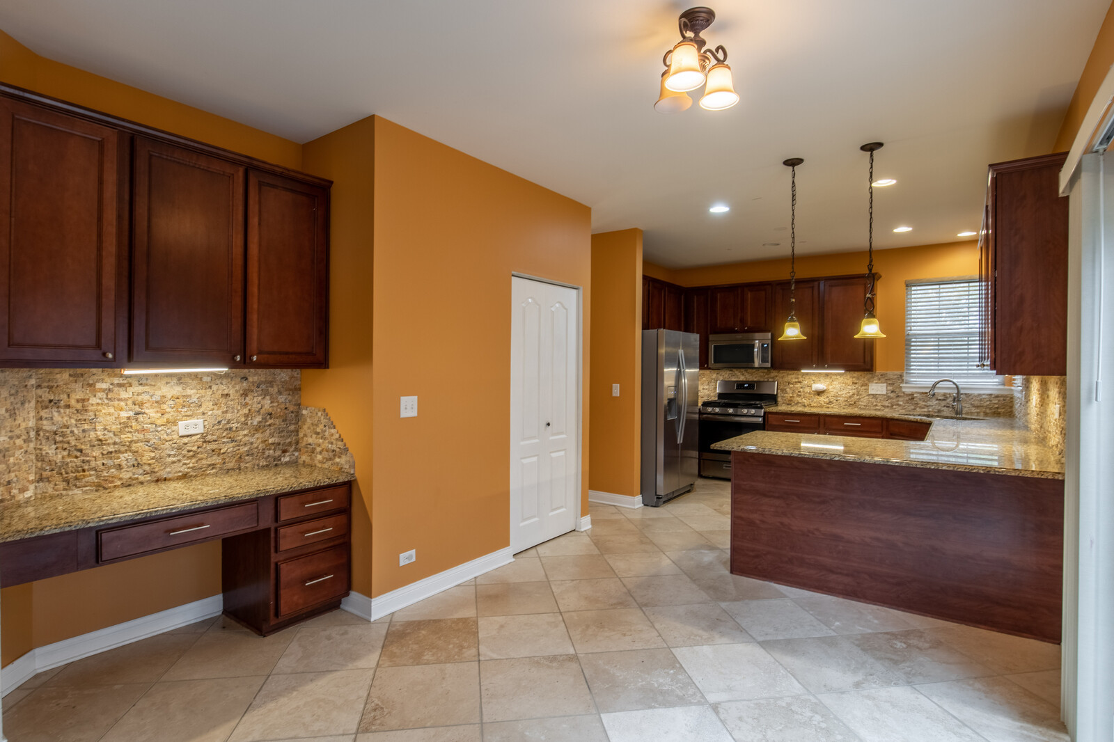 2101 Silverleaf Court Addison, IL 60101 - Photo 18 of 41 a kitchen with stainless steel appliances granite countertop wooden cabinets a sink and dishwasher