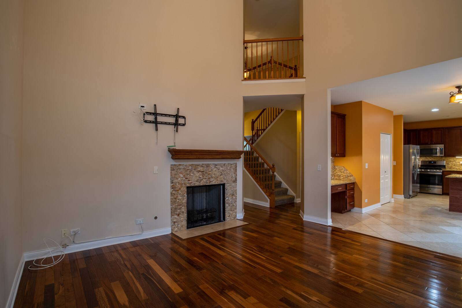 2101 Silverleaf Court Addison, IL 60101 - Photo 19 of 41 a view of a livingroom with wooden floor and a fireplace