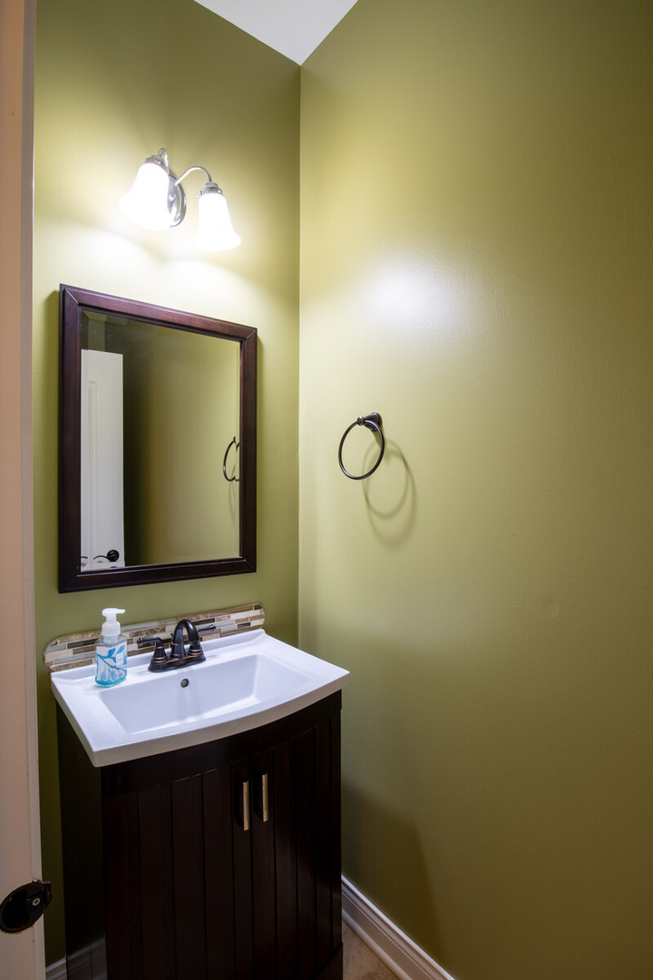 2101 Silverleaf Court Addison, IL 60101 - Photo 22 of 41 a bathroom with a sink and a mirror