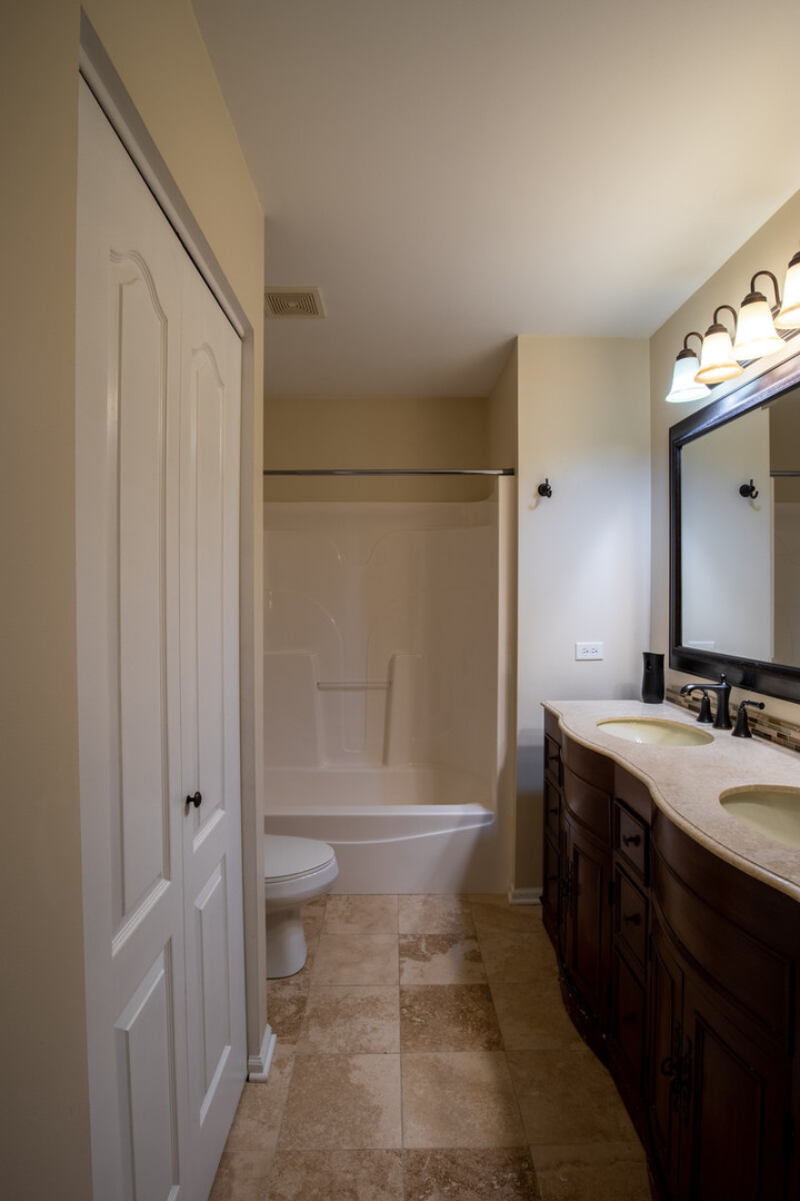 2101 Silverleaf Court Addison, IL 60101 - Photo 36 of 41 a bathroom with a sink a toilet and shower