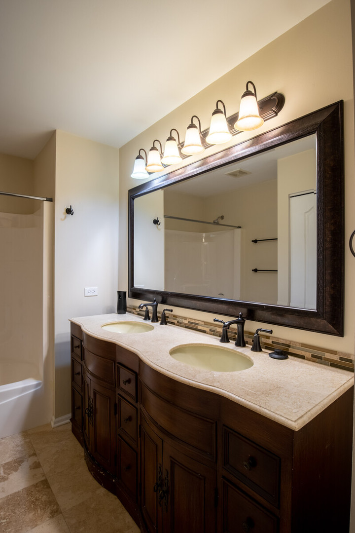 2101 Silverleaf Court Addison, IL 60101 - Photo 37 of 41 a bathroom with a sink and a mirror