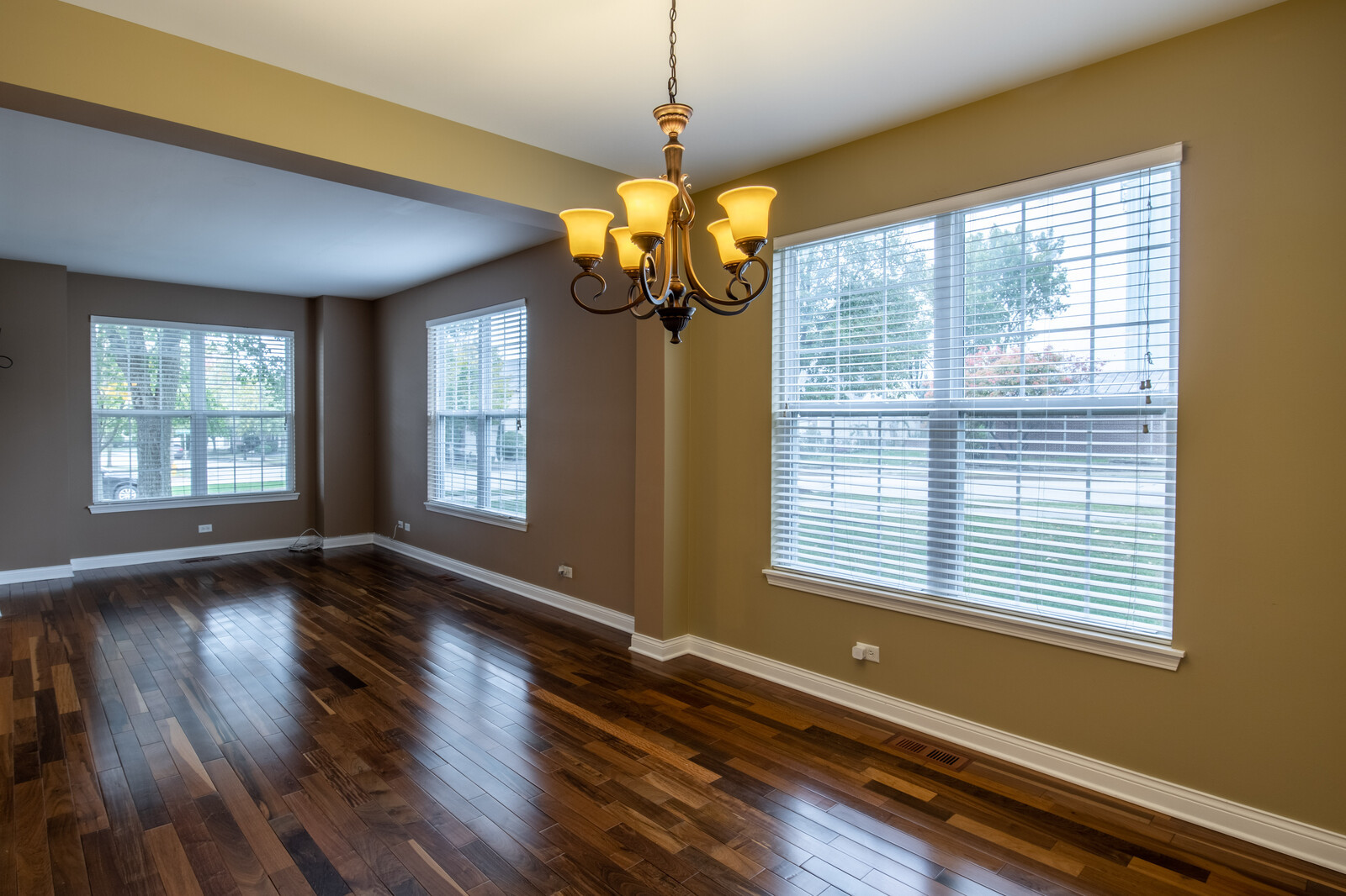 2101 Silverleaf Court Addison, IL 60101 - Photo 10 of 41 a view of a room with wooden floor and windows