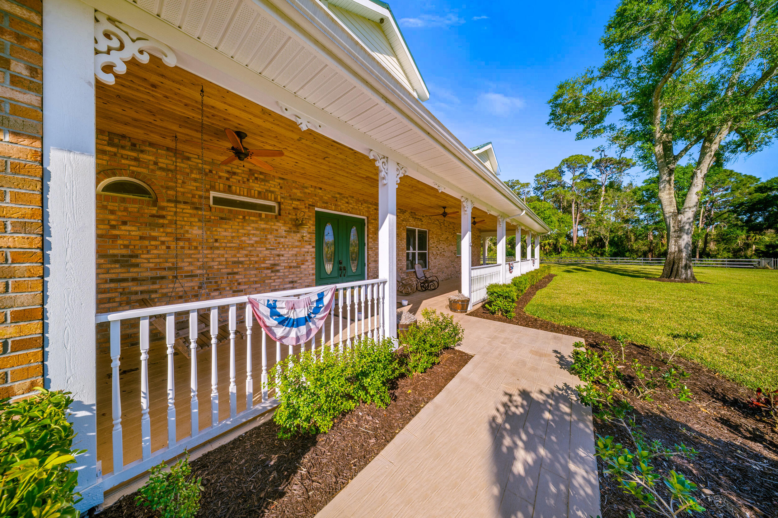 8686 Andrews Avenue Fort Pierce, FL 34945 - Photo 10 of 76 a view of a pathway with a garden