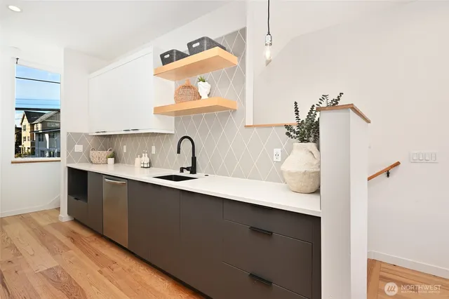 a kitchen with a sink and cabinets