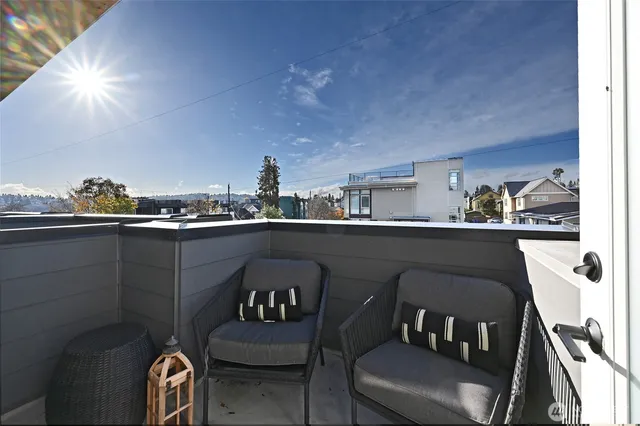 a dining room with furniture and a lamp