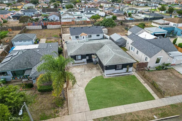 an aerial view of a house with a garden