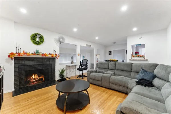 a living room with furniture and a fireplace