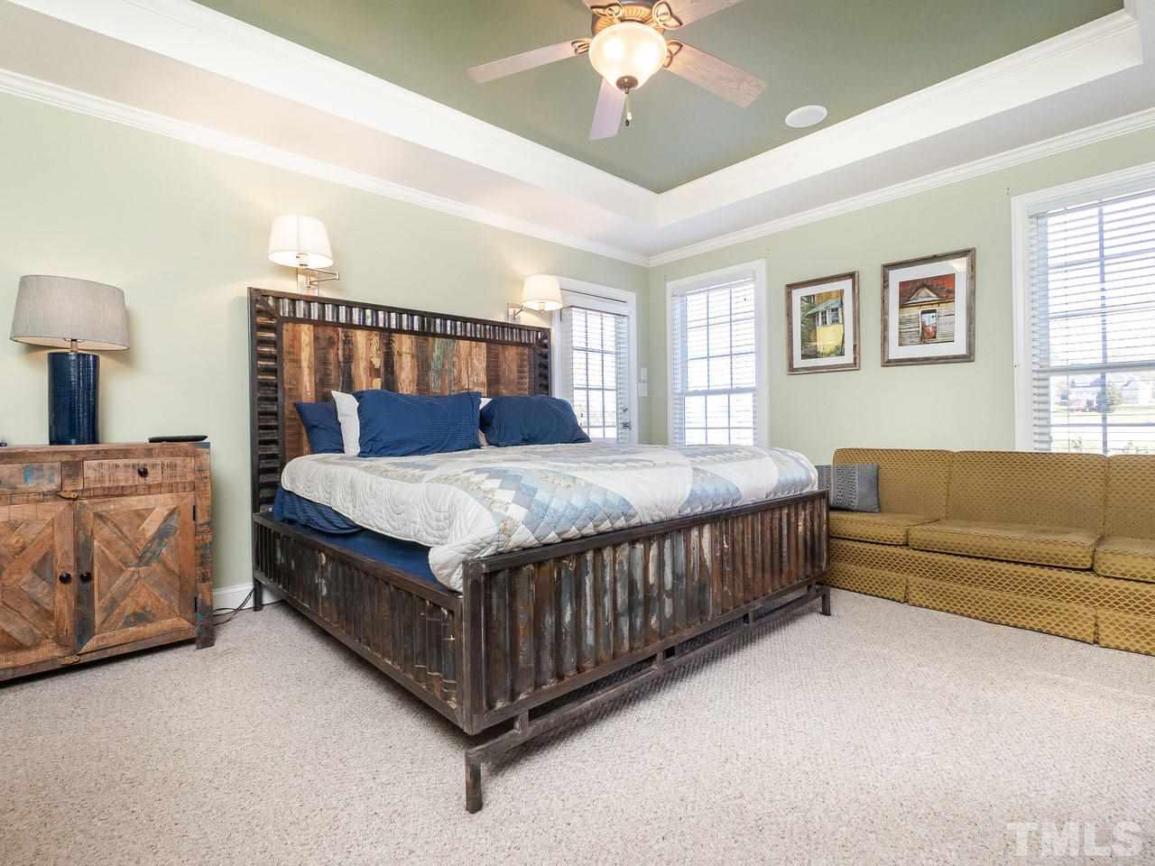 326 Challenge Road Raleigh, NC 27603 - Photo 15 of 30 a bedroom with a bed couch and window