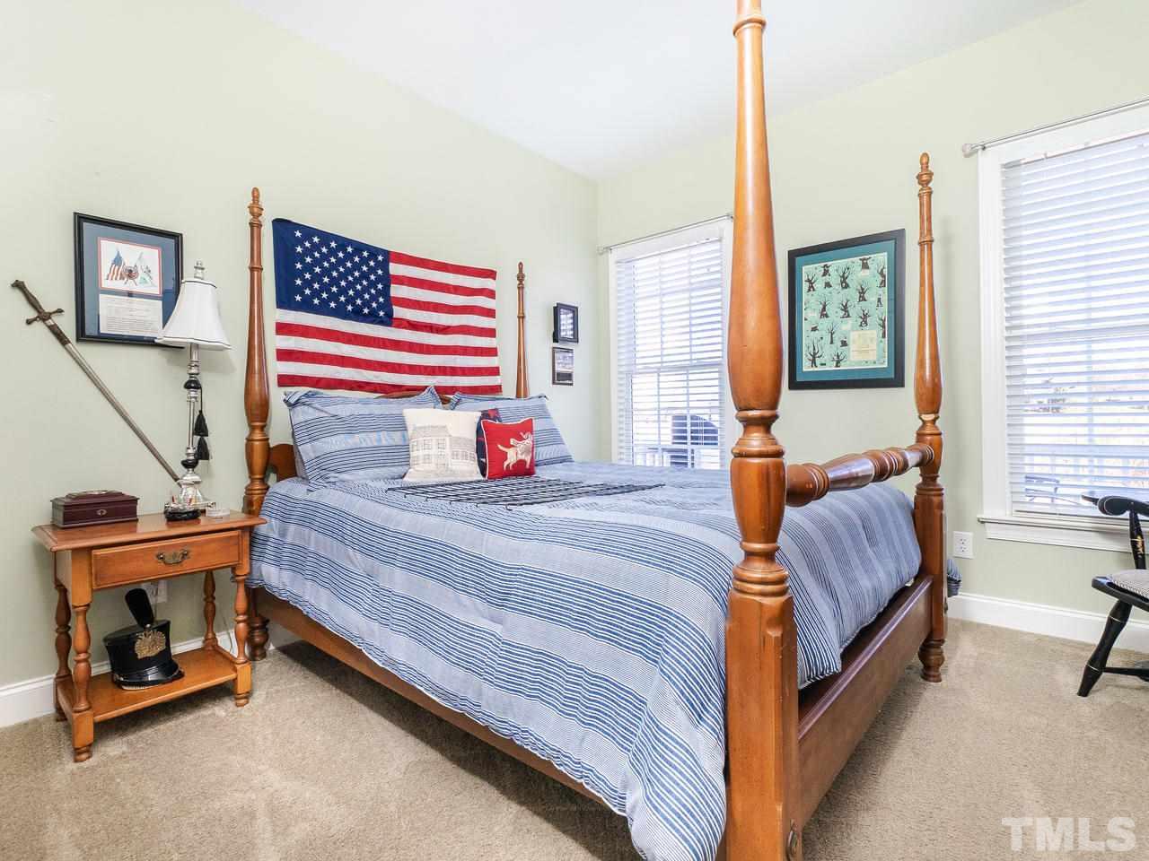 326 Challenge Road Raleigh, NC 27603 - Photo 21 of 30 a bedroom with a bed and a window