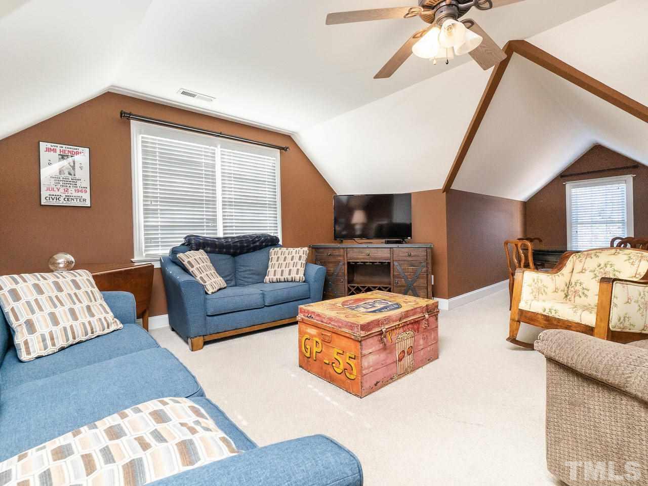 326 Challenge Road Raleigh, NC 27603 - Photo 23 of 30 a living room with furniture and a couch