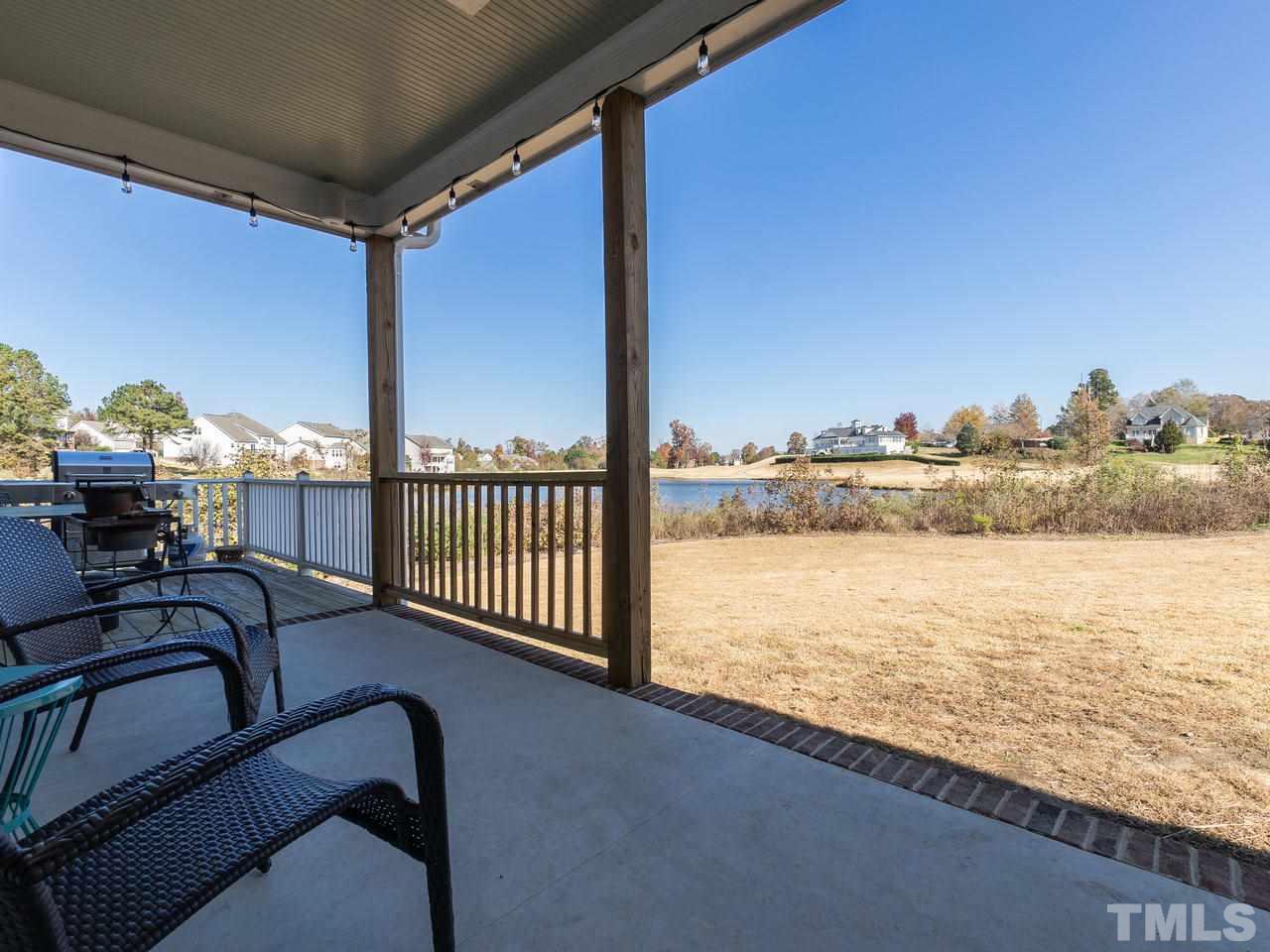 326 Challenge Road Raleigh, NC 27603 - Photo 29 of 30 a view of a balcony with chair and ocean view