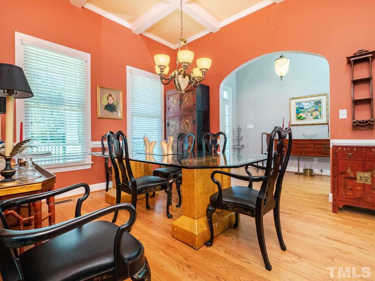 326 Challenge Road Raleigh, NC 27603 - Photo 5 of 30 a view of a dining room with furniture and wooden floor
