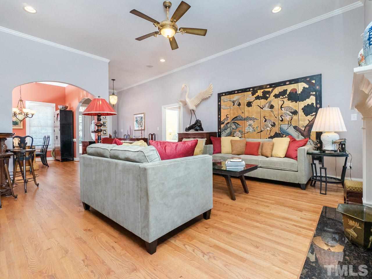326 Challenge Road Raleigh, NC 27603 - Photo 8 of 30 a living room with furniture and wooden floor