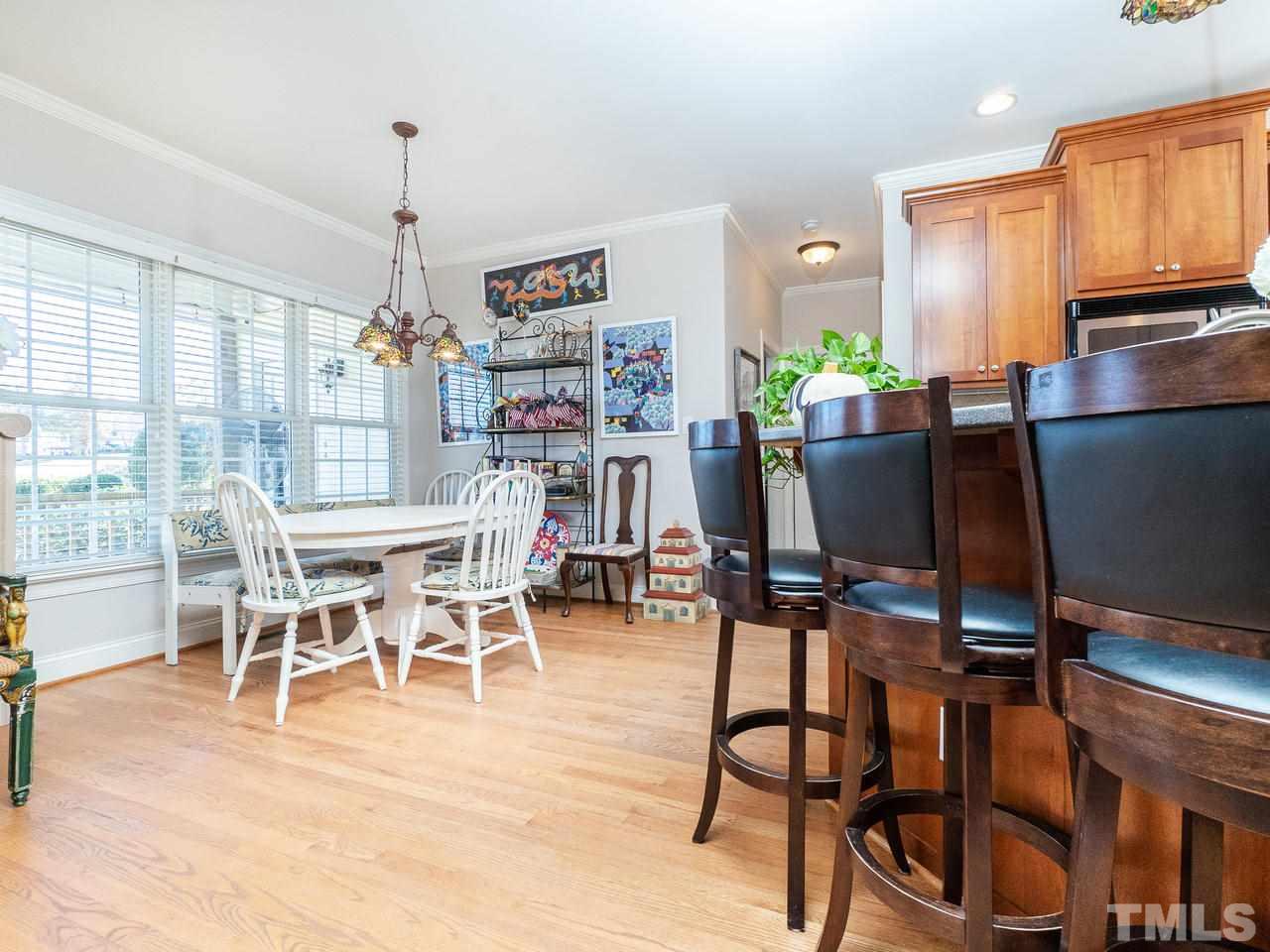 326 Challenge Road Raleigh, NC 27603 - Photo 9 of 30 a view of a dining room with furniture window and outside view