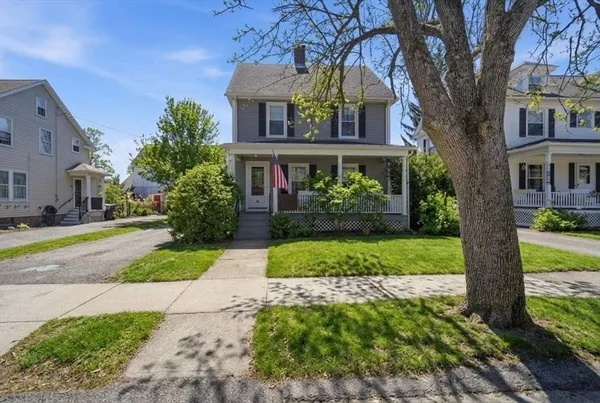 a front view of house with yard and green space