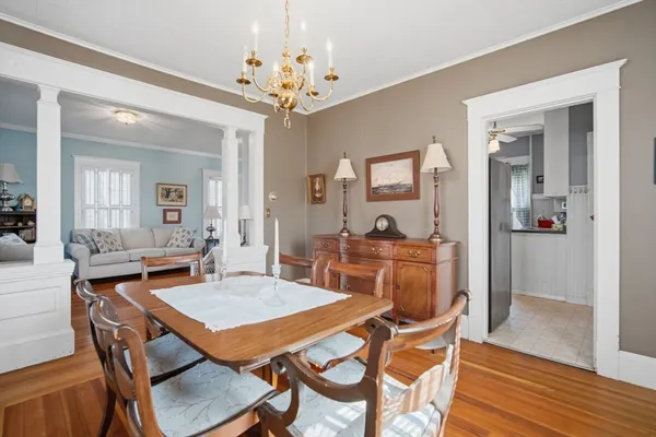 a view of a dining room with furniture and wooden floor