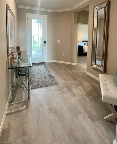 a view of a room that has a couch and a chair in it