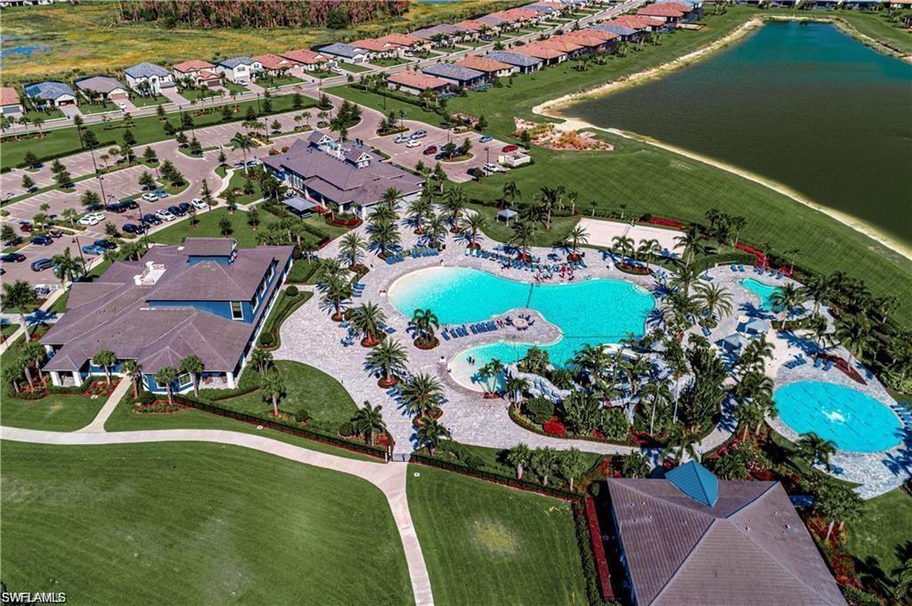 19824 Beechcrest Place Estero, FL 33928 - Photo 19 of 26 an aerial view of a house with a garden and lake view