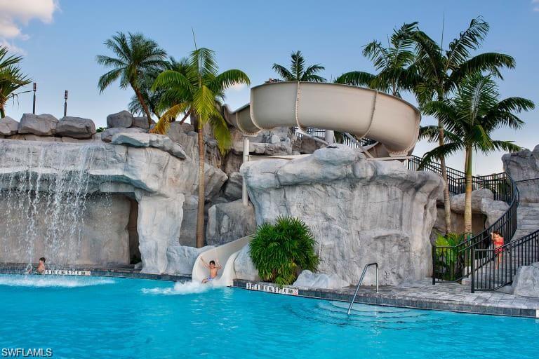 19824 Beechcrest Place Estero, FL 33928 - Photo 21 of 26 a house with palm tree in front of it