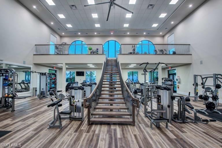 19824 Beechcrest Place Estero, FL 33928 - Photo 22 of 26 a view of a room with lots of wooden furniture
