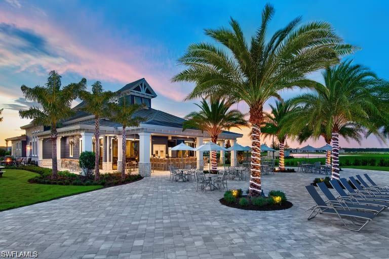 19824 Beechcrest Place Estero, FL 33928 - Photo 25 of 26 a front view of multiple houses with yard