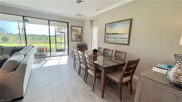 a view of a dining room with furniture window and outside view