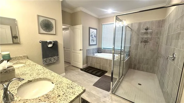 a bathroom with a sink and shower