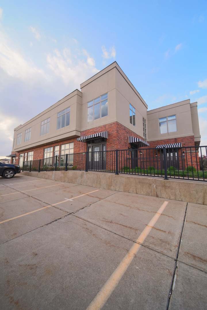4935 Utica Ridge Road, Unit 220 Davenport, IA 52807 - Photo 1 of 29 a front view of a building