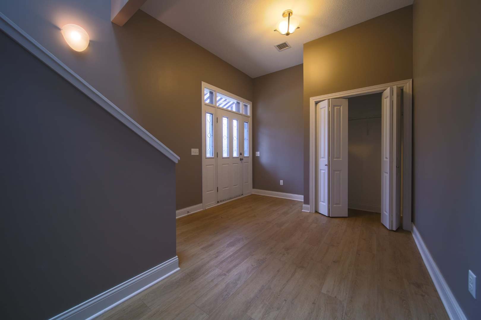 4935 Utica Ridge Road, Unit 220 Davenport, IA 52807 - Photo 12 of 29 an empty room with wooden floor and windows
