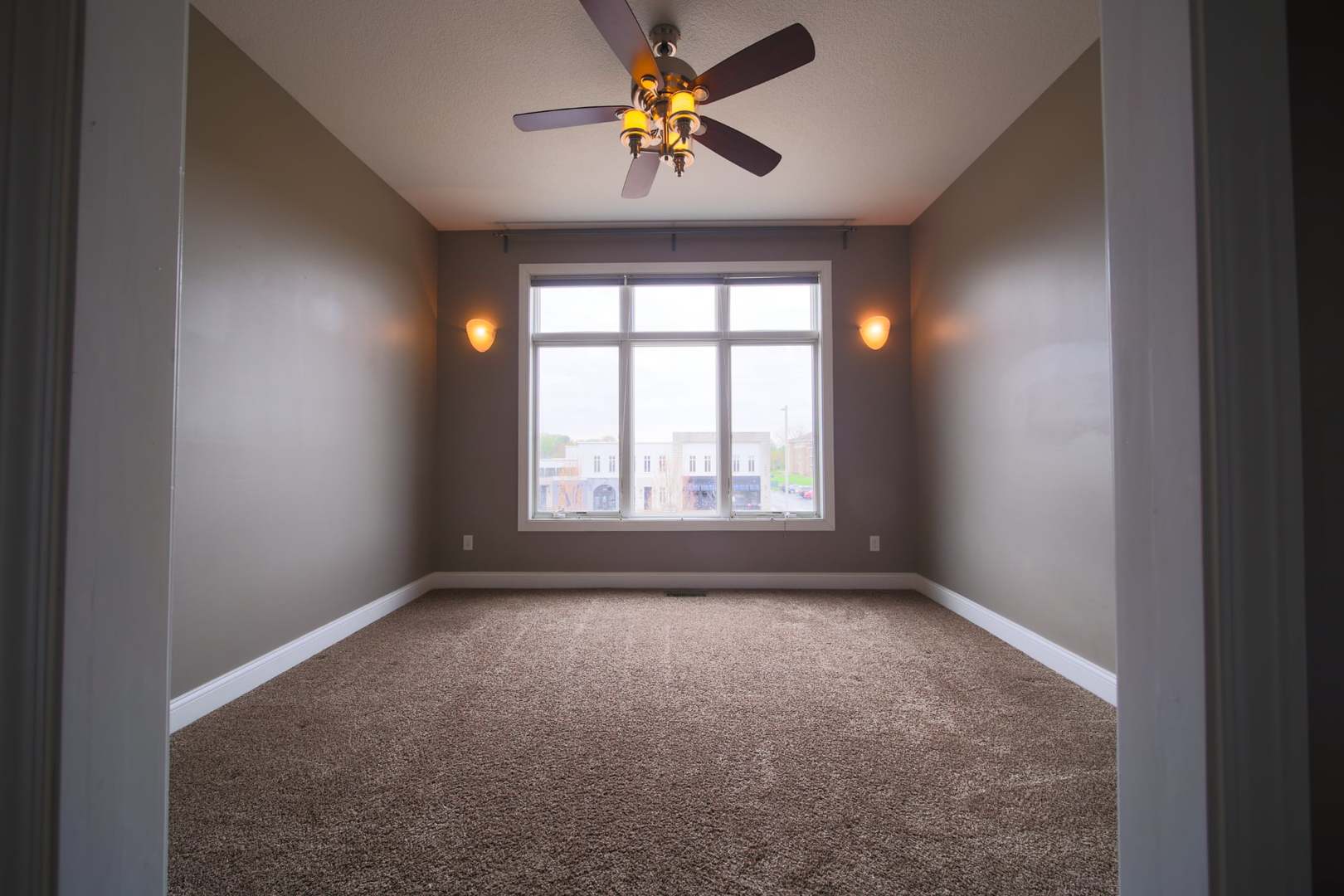 4935 Utica Ridge Road, Unit 220 Davenport, IA 52807 - Photo 16 of 29 a view of empty room with window
