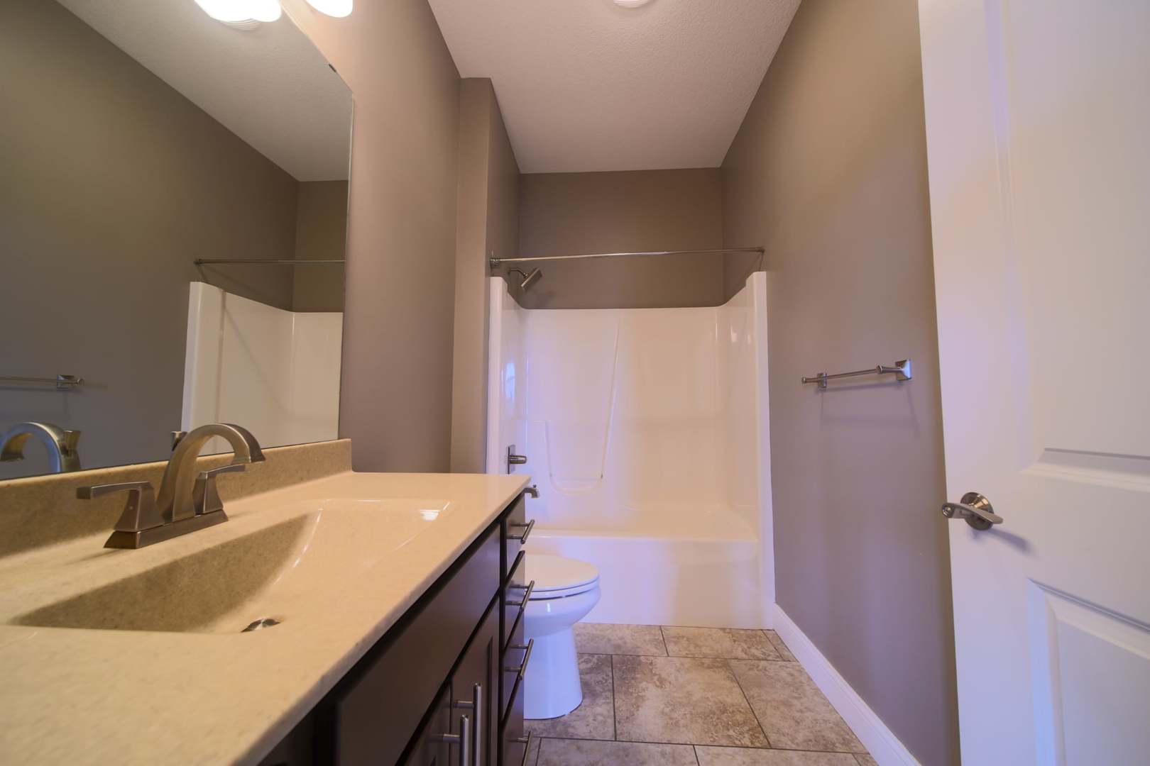 4935 Utica Ridge Road, Unit 220 Davenport, IA 52807 - Photo 19 of 29 a bathroom with a sink and a mirror