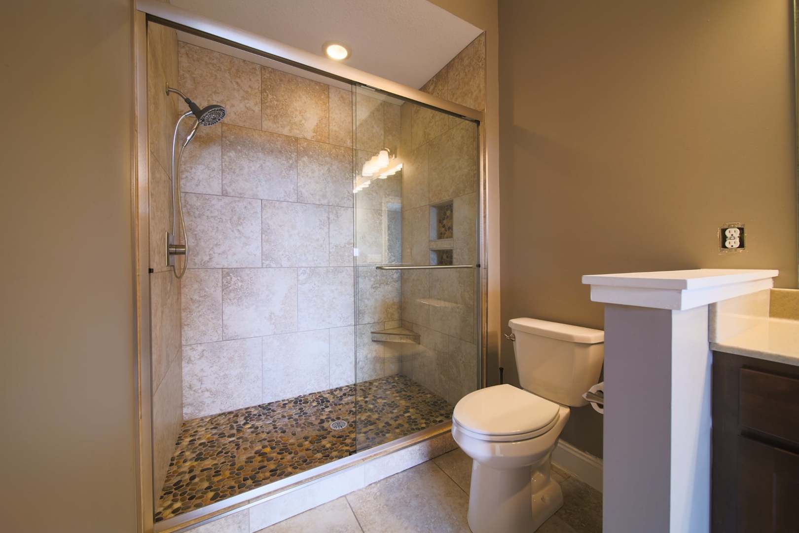 4935 Utica Ridge Road, Unit 220 Davenport, IA 52807 - Photo 25 of 29 a bathroom with a toilet and a shower