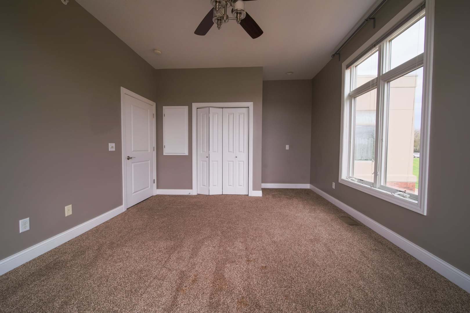 4935 Utica Ridge Road, Unit 220 Davenport, IA 52807 - Photo 26 of 29 a view of an empty room with a window
