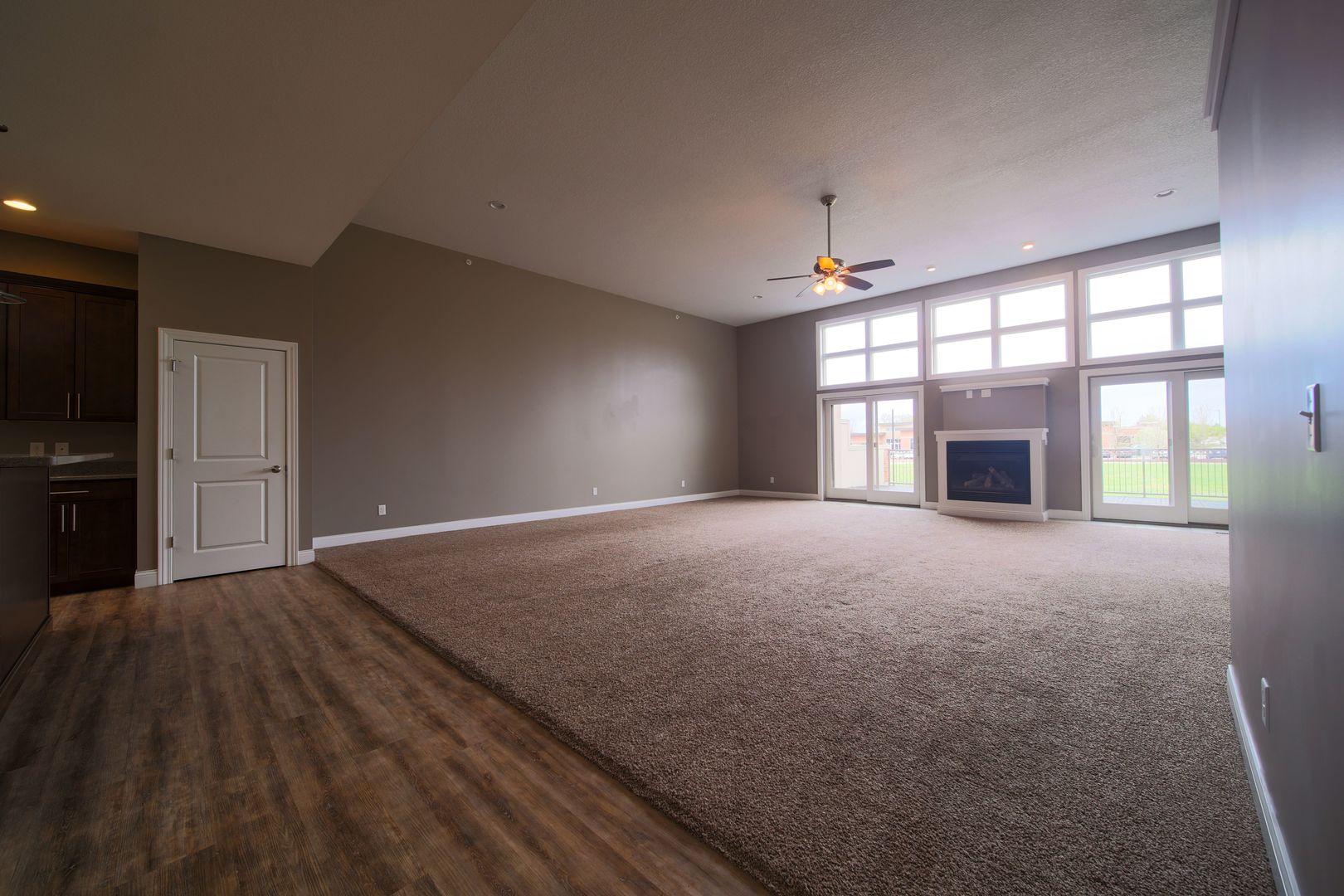 4935 Utica Ridge Road, Unit 220 Davenport, IA 52807 - Photo 7 of 29 an empty room with fireplace and windows