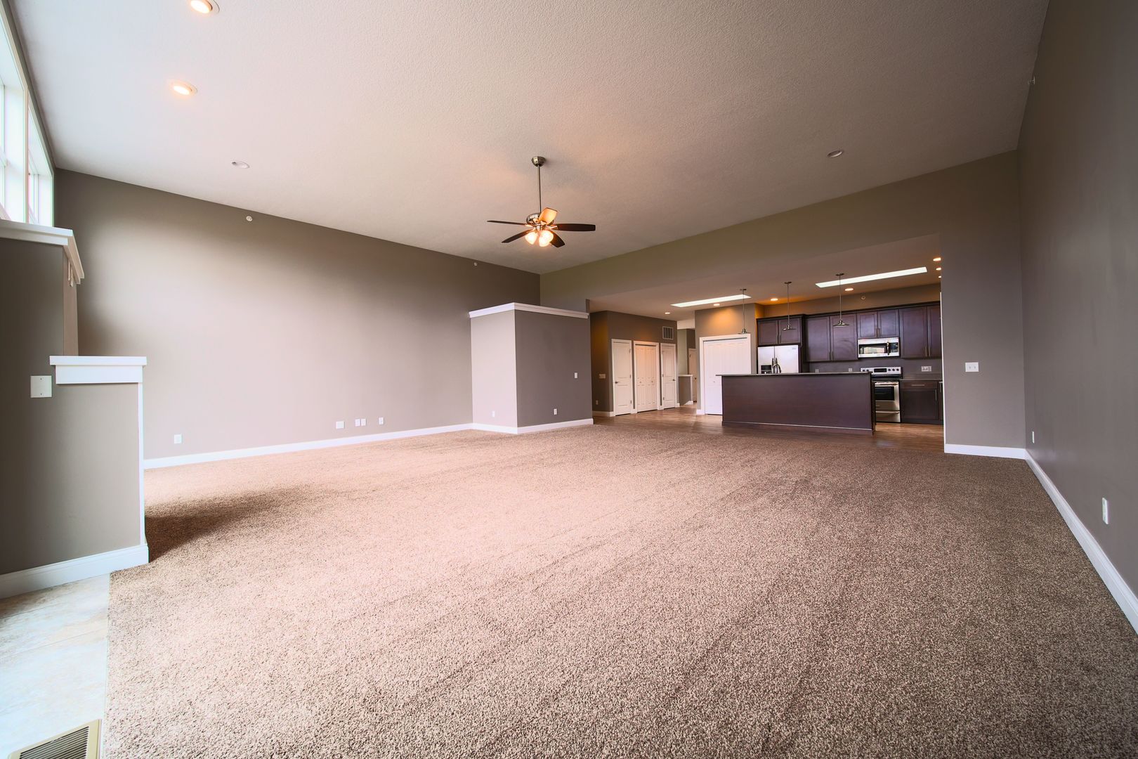 4935 Utica Ridge Road, Unit 220 Davenport, IA 52807 - Photo 9 of 29 a view of a livingroom with furniture and chandelier