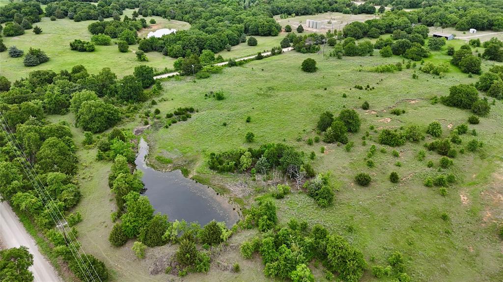 2753 Big Tree Road Montague, TX 76251 - Photo 1 of 40 an aerial view of a house with a yard