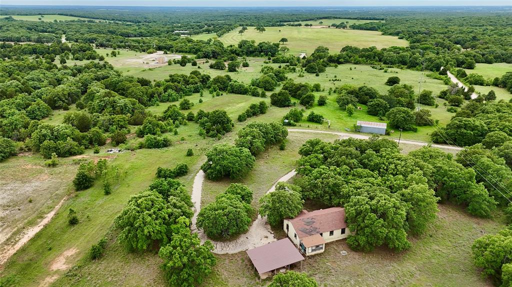 2753 Big Tree Road Montague, TX 76251 - Photo 3 of 40 an aerial view of a house with a yard