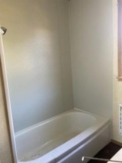 2753 Big Tree Road Montague, TX 76251 - Photo 31 of 40 a bathroom with a bathtub
