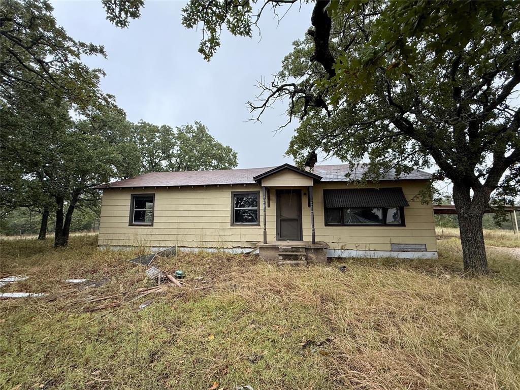 2753 Big Tree Road Montague, TX 76251 - Photo 35 of 40 a front view of a house with garden