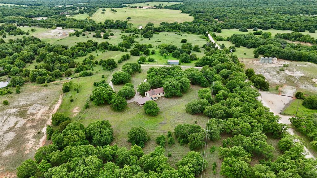 2753 Big Tree Road Montague, TX 76251 - Photo 38 of 40 an aerial view of residential house with outdoor space and trees all around
