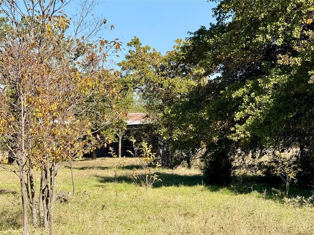 a view of swimming pool with a yard