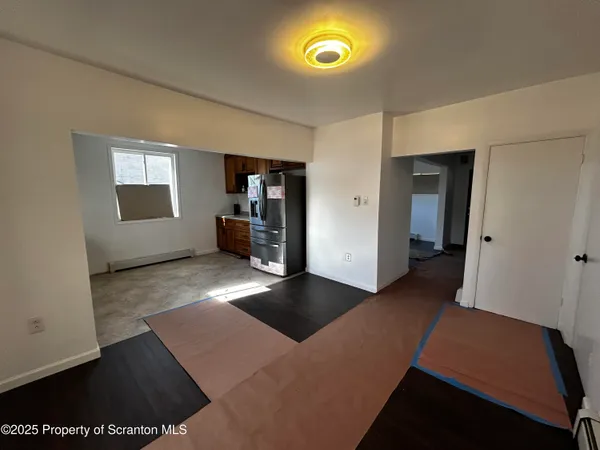a view of an empty room and window