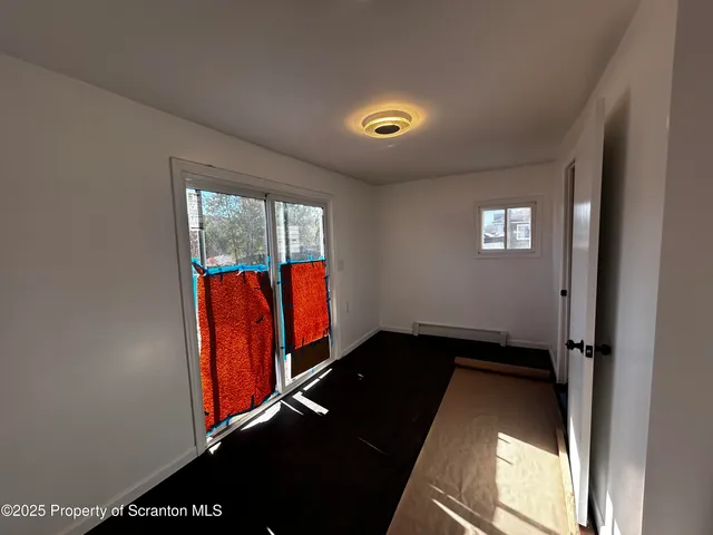 a view of an empty room and window