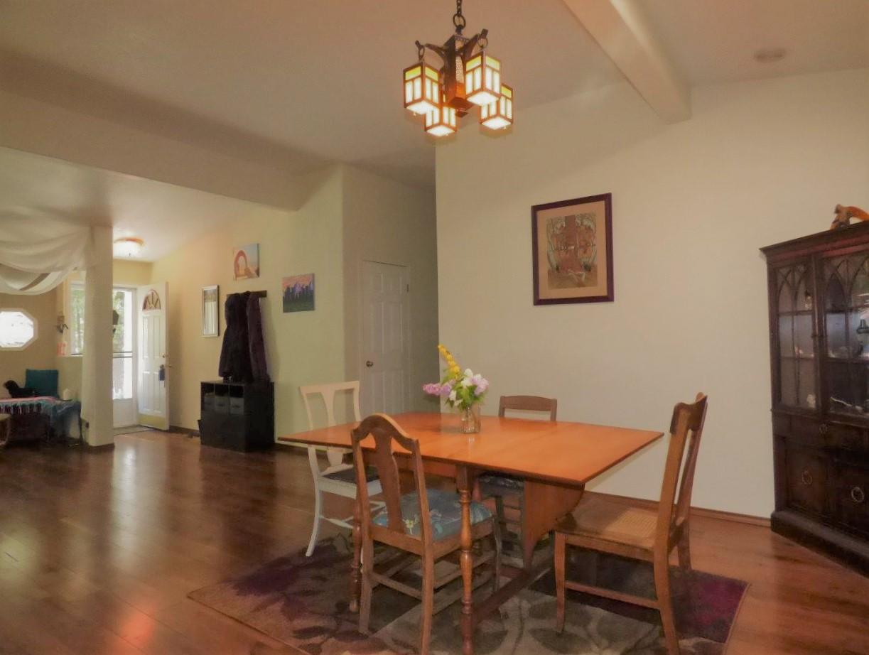 6520 Tunnel Loop Road Grants Pass, OR 97526 - Photo 18 of 69 a view of a dining room with furniture and wooden floor