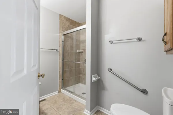 a bathroom with a shower and toilet