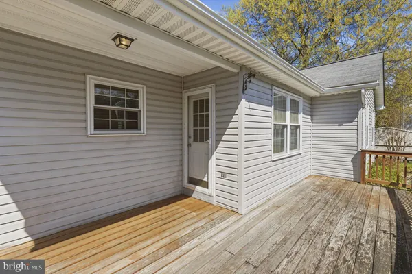a view of a house with a yard and wooden floor
